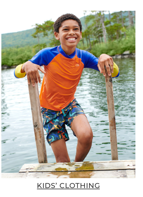 Boy climbing out of the water.