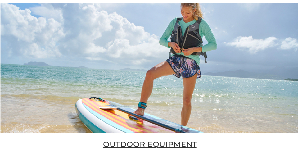 Person getting ready to go paddleboarding.